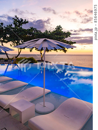 Sunset at the edge of a swimming pool at Kata beach in Phuket province, in Thailand 85646975