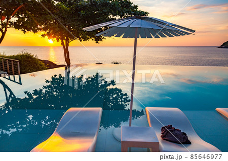 Sunset at the edge of a swimming pool at Kata beach in Phuket province, in Thailand 85646977