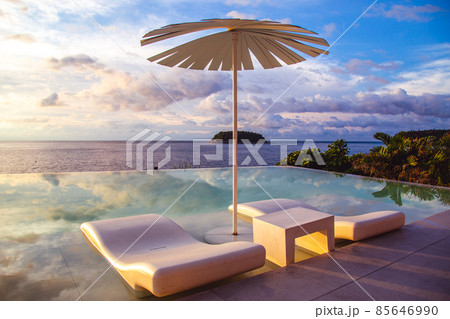 Sunset at the edge of a swimming pool at Kata beach in Phuket province, in Thailand 85646990
