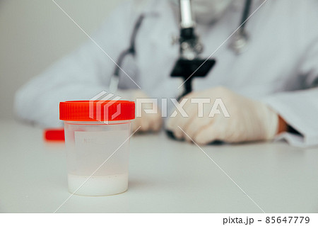 Doctor analyzing semen samples in laboratory 85647779