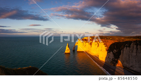Amazing sunset on the coast in Etretat, Normandy, France Amazing sunset on the coast in Etretat, Normandy, France 85648550