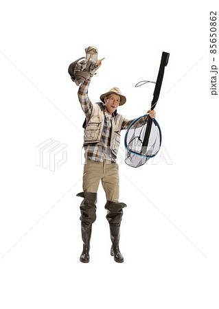 Portrait of young man, professional fisherman with fishing rod, spinning and equipment going to river isolated over white studio background Portrait of young man, professional fisherman with fishing rod, spinning and equipment going to river isolated over white studio background 85650862