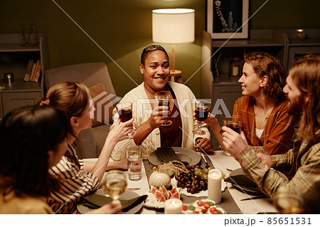 People sitting at dining table at home People sitting at dining table at home 85651531