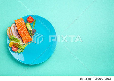 Intermittent fasting low carb hight fats diet concept flat lay, healthy food on blue plate 85651868