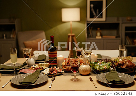 Dining table with food in the living room Dining table with food in the living room 85652242