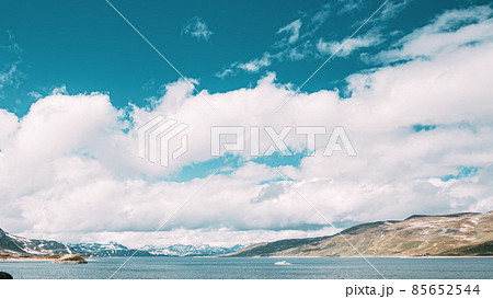 Oppland, Tyin Lake, Norway. Stones On Coast Of Beautiful Lake Tyin In Summer Day. Norwegian Nature. 4K Oppland, Tyin Lake, Norway. Stones On Coast Of Beautiful Lake Tyin In Summer Day. Norwegian Nature. 4K 85652544