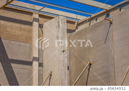 Construction site with precast concrete columns, beams and walls Construction site with precast concrete columns, beams and walls 85654552
