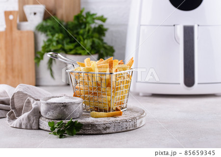 French fries cooked in air fryer. French fries cooked in air fryer. 85659345