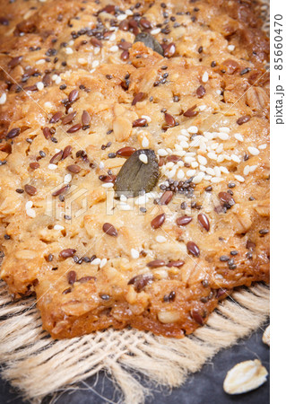 Fresh baked oatmeal cookies on jute canvas. Delicious crunchy dessert Fresh baked oatmeal cookies on jute canvas. Delicious crunchy dessert 85660470