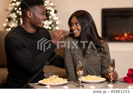 African American Husband Feeding Wife Flirting During Romantic Date Indoor 85661253