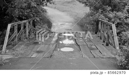 Beautifully standing old wooden bridge over river in colored background 85662970