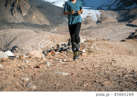 Man is running, training in the moruntains. 85665289