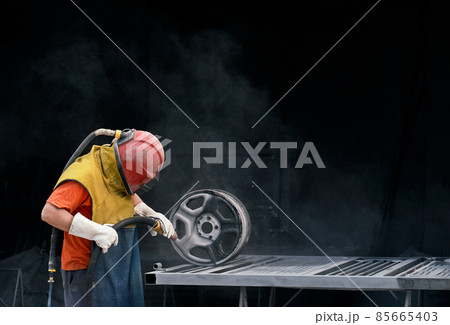 Worker working with tools for making gates. Worker working with tools for making gates. 85665403