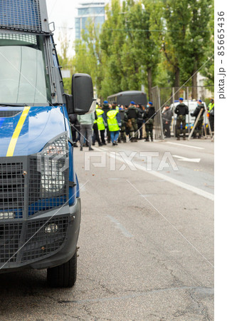 Police are blocking the street. Police checkpoint. 85665436