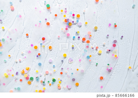 Abstract rainbow colored glitter particles. Macro of kids toy slime. Closeup view of colorful slime splash. Rainbow palette. Wallpaper for school banner or handmade masterclass.  85666166