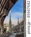 Top view from the roof of Duomo di Milano Cathedral with marble statues. Milan, Italy. 85667682