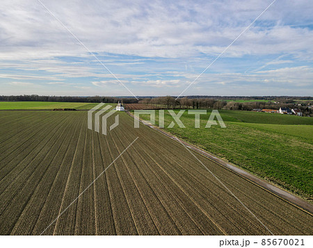 Areal view of agricultural field against cloudy sky Areal view of agricultural field against cloudy sky 85670021