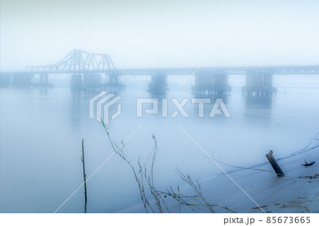 Bridge in the fog. Bridge over the river. Long Bien bridge in a misty morning 85673665