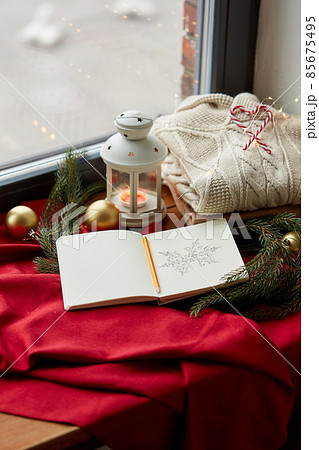 sketchbook, christmas lantern, sweater, fir branch 85675495