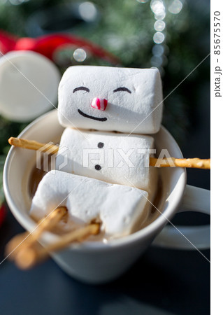 marshmallow snowman in cup of coffee on christmas 85675570