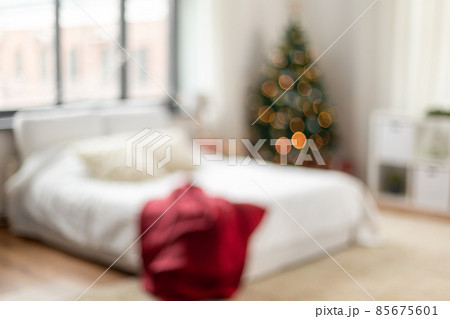 blurred bed in bedroom at cozy home on christmas 85675601