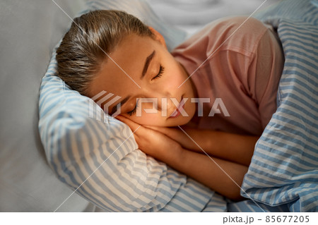 girl sleeping in bed at home girl sleeping in bed at home 85677205