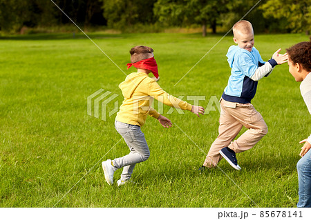 happy children playing and running at park 85678141