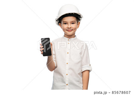 little boy in construction helmet with smartphone little boy in construction helmet with smartphone 85678607