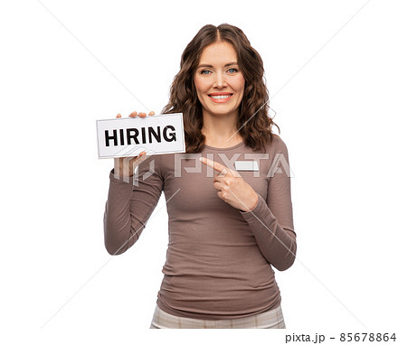 happy female shop assistant with hiring banner happy female shop assistant with hiring banner 85678864
