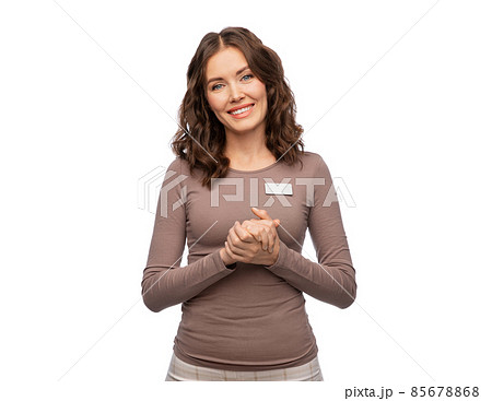 happy female shop assistant with name tag happy female shop assistant with name tag 85678868