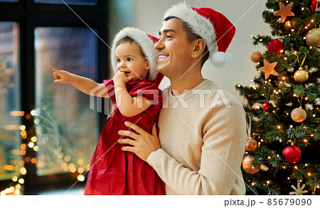 father and baby daughter on christmas at home father and baby daughter on christmas at home 85679090