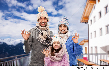 happy family showing ok gesture in winter happy family showing ok gesture in winter 85679917