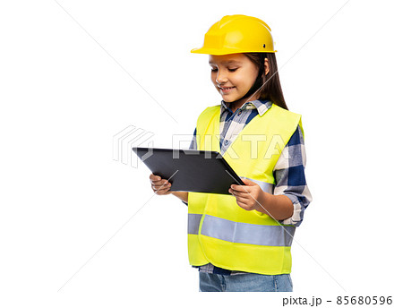 girl in helmet and safety vest with tablet pc 85680596
