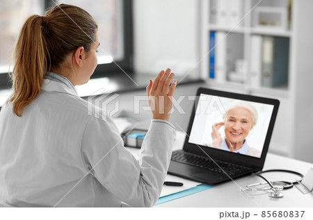 doctor with laptop having video call with patient 85680837