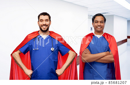 smiling doctors or male nurses in superhero capes smiling doctors or male nurses in superhero capes 85681207