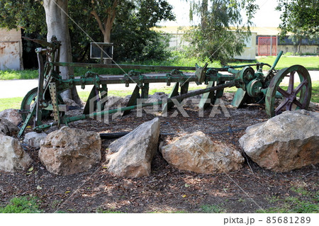 Old agricultural machinery used to work in the fields in Israel Old agricultural machinery used to work in the fields in Israel 85681289