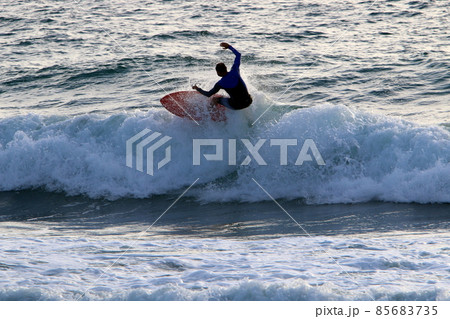 Surfing big waves in the Mediterranean Sea off the northern coast of Israel 85683735