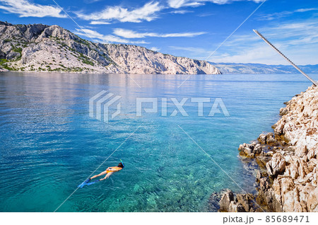 Womansnorkeling in the sea Womansnorkeling in the sea 85689471