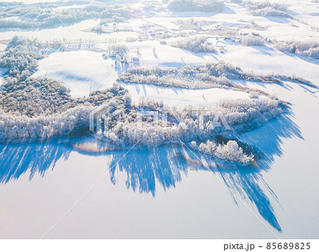 Fabulous aerial winter landscape background of frost on branches, extremely cold environment conditions, cold winter day with sunlight Fabulous aerial winter landscape background of frost on branches, extremely cold environment conditions, cold winter day with sunlight 85689825