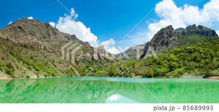 Beautiful sunny valley between the mountains with lush clouds in the Crimea, Ukraine Beautiful sunny valley between the mountains with lush clouds in the Crimea, Ukraine 85689993