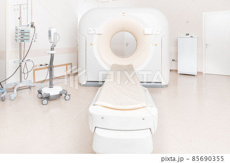 Medical CT or MRI Scan in the modern hospital laboratory. Interior of radiography department. Technologically advanced equipment in white room. Magnetic resonance diagnostics machine. Medical CT or MRI Scan in the modern hospital laboratory. Interior of radiography department. Technologically advanced equipment in white room. Magnetic resonance diagnostics machine. 85690355