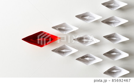 Leadership concept. Red paper ship lead among white. One leadership leads other ships. 85692467