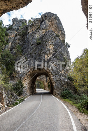 Tunnel hole at Serrania de Cuenca in Spain near Cuenca and Fuertescusa. Door to hell Tunnel hole at Serrania de Cuenca in Spain near Cuenca and Fuertescusa. Door to hell 85694404