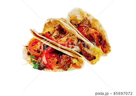 Tacos with ribs, pickled onions, fresh tomatoes and sauces isolated on white Tacos with ribs, pickled onions, fresh tomatoes and sauces isolated on white 85697072