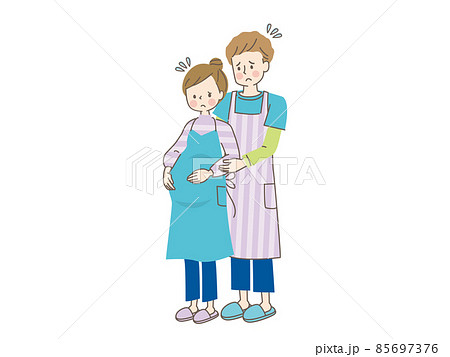 お腹の中の赤ちゃんを心配する妊婦と寄り添う夫 85697376