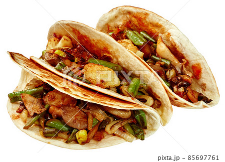 Vegan tacos with oyster mushrooms, broccoli, corn, leeks, peppers and green beans 85697761