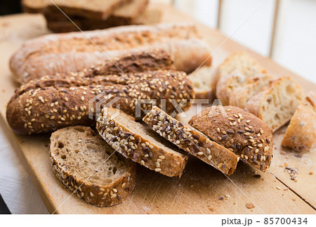 fresh loaf of bread on wooden board 85700434