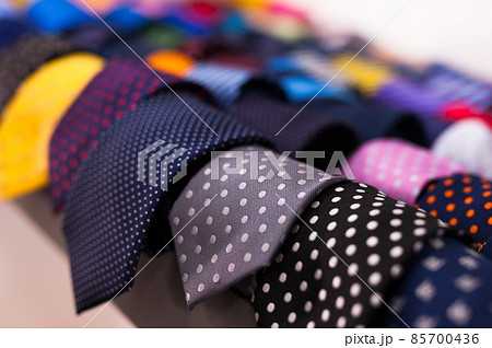 ties on hangers in men clothing store 85700436