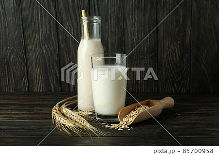 Concept of vegan milk on wooden background 85700958