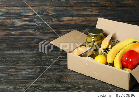 Concept of donate with donation box on wooden table Concept of donate with donation box on wooden table 85700996